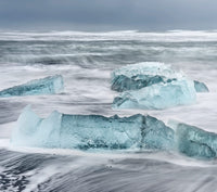 Icebergs on black volcanic beach near Jokulsarlon lagoon, Iceland poster print by Martin Zwick.