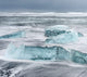 Icebergs on black volcanic beach near Jokulsarlon lagoon, Iceland poster print by Martin Zwick.