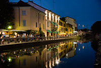 Milan Naviglio Grande Canal area poster print by Alan Klehr showcasing vibrant nightlife.