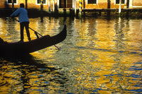 Venice Gondolier steering gondola at sunset poster print.