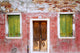 Burano weathered house exterior poster print by Jaynes Gallery, showcasing vibrant Italian architecture.