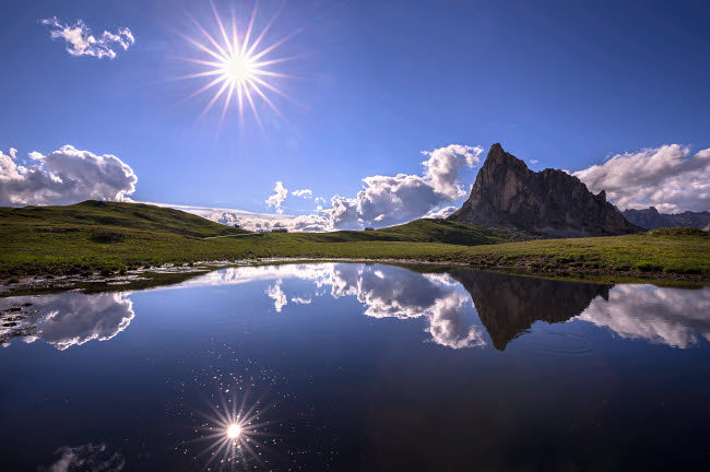 Italy Dolomites Giau Pass Mountain Tarn Poster Print showcasing sun reflection.