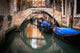 Venice Canal with gondolas and bridges poster print by Jim Nilsen
