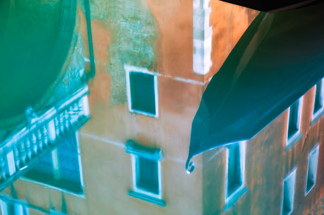Venice gondola and building reflection in canal poster print.