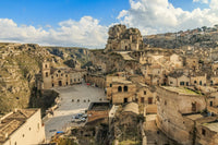 Matera Canyon View Poster Print by Emily Wilson showcasing the beautiful town of Matera in Italy.