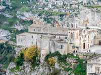 The Chiesa di San Pietro Caveoso Poster Print by Julie Eggers showcasing the architectural beauty of Matera.