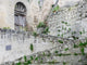 Cobblestone steps leading to a traditional Sassi home in Matera.