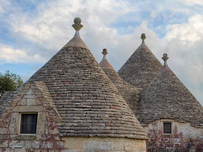 Alberobello Rooftops Poster Print showcasing trulli houses in Italy by Julie Eggers.