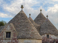 Alberobello Rooftops Poster Print showcasing trulli houses in Italy by Julie Eggers.