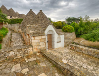 Alberobello Trulli Houses Poster Print by Julie Eggers showcasing iconic Italian architecture.