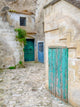 Matera Doors in a Courtyard Poster Print by Julie Eggers