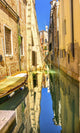 Colorful small boats reflecting in Venice, Italy poster print by William Perry.