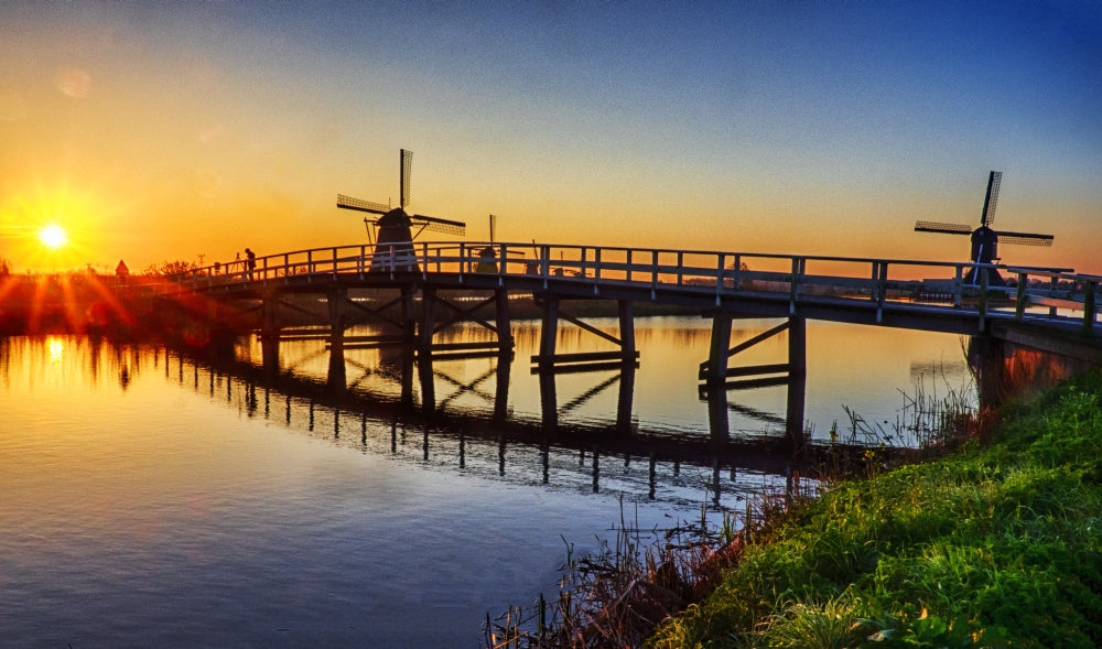 Kinderdijk Windmill and Bridge at Sunrise Poster Print by Terry Eggers