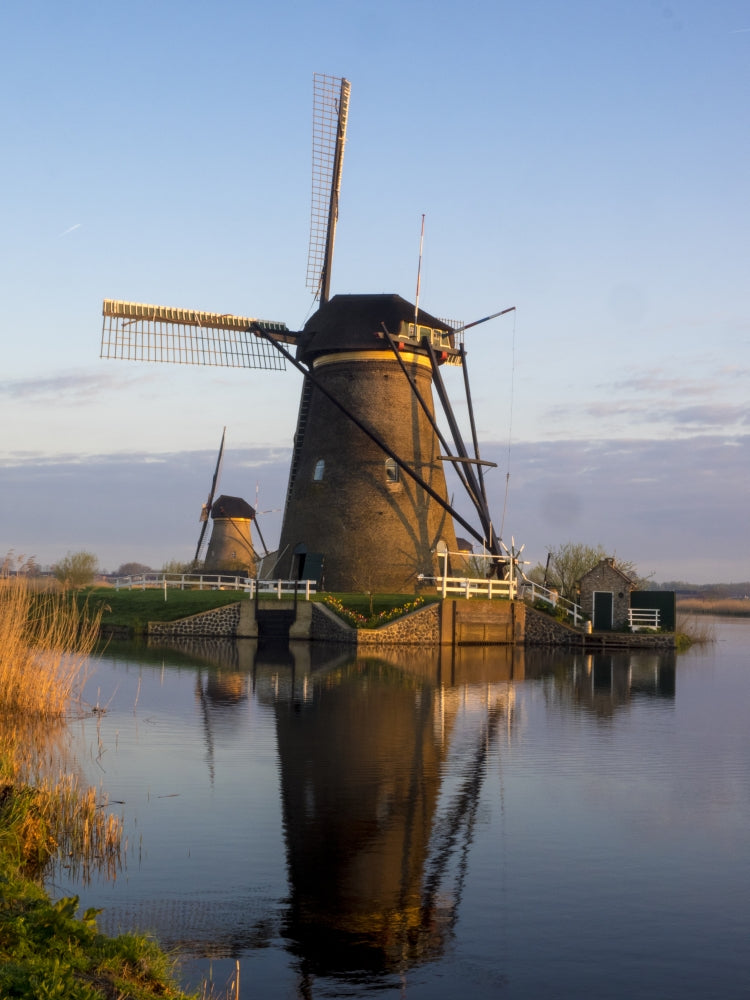 Kinderdijk Windmill along the canal in morning light, poster print by Terry Eggers.