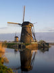 Kinderdijk Windmill along the canal in morning light, poster print by Terry Eggers.