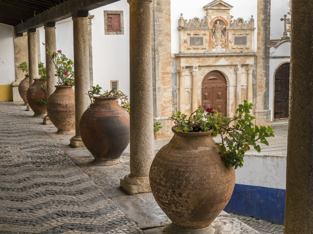 Poster print of ceramic pots on a ledge in Obidos, Portugal by Julie Eggers.