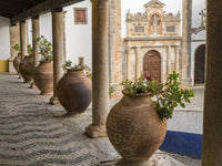 Poster print of ceramic pots on a ledge in Obidos, Portugal by Julie Eggers.