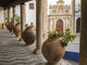 Poster print of ceramic pots on a ledge in Obidos, Portugal by Julie Eggers.