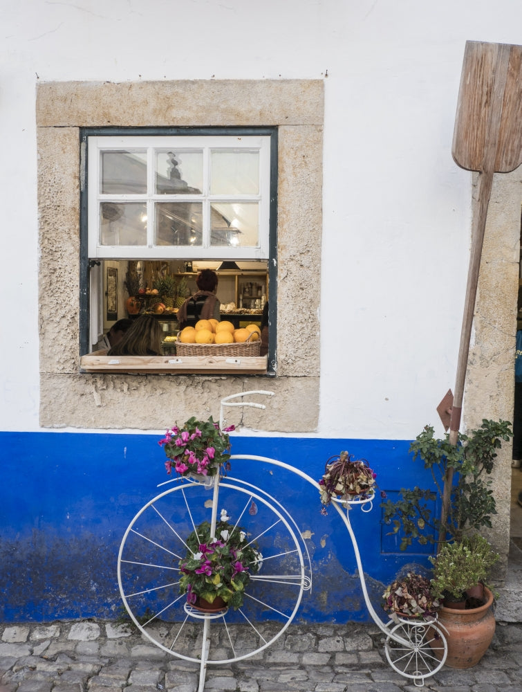 Charming bicycle planter in front of a bakery in Obidos, Portugal - Poster Print by Julie Eggers