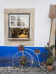 Charming bicycle planter in front of a bakery in Obidos, Portugal - Poster Print by Julie Eggers