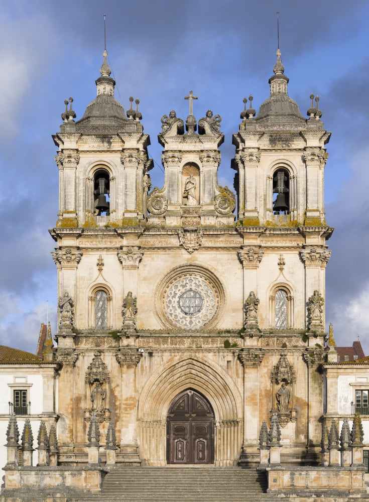 The Monastery of Alcobaca Poster Print by Martin Zwick, featuring rich details of the architectural masterpiece in Portugal.