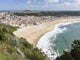 View over Nazare town and beach in Portugal poster print by Martin Zwick