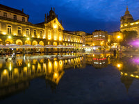 Sunset along the sidewalk of cafe at Praca da Republica, Braga Poster Print by Terry Eggers.