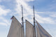 Gloucester Schooner Festival Poster Print by Walter Bibikow showcasing vibrant schooners at sea.