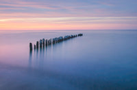 Twilight Over Lake Superior Poster Print by Alan Majchrowicz featuring serene beach scenery.