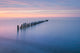 Twilight Over Lake Superior Poster Print by Alan Majchrowicz featuring serene beach scenery.