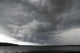 Storm Over Lake Waukaunabo poster print by Gayle Harper showcasing a dramatic landscape.