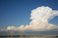 Clark Bridge over Mississippi River poster print featuring cumulonimbus clouds by Richard & Susan Day.