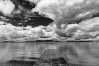 Dock reaching into Skidoo Bay at Flathead Lake poster print by Chuck Haney.