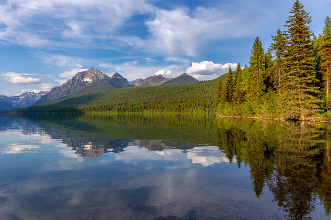 Calm Reflection on Bowman Lake in Glacier National Park Poster Print by Chuck Haney