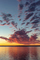 Vivid sunrise clouds over Fort Peck Reservoir poster print by Chuck Haney