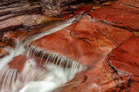 Red Rocks at Virginia Creek in Glacier National Park Poster Print by Chuck Haney