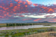 Sunrise and clouds over the Yellowstone River Poster Print by Chuck Haney