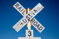 Worn Railroad Crossing Sign Poster Print by Darrell Gulin