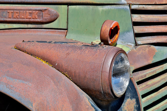 Headlight on Old Truck Detail in Sprague, Washington State Poster Print by Darrell Gulin