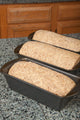 Three Bread Pans of Multigrain Dough Ready for Final Rising Poster Print by Janet Horton