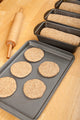Multigrain bread dough poster print by Janet Horton showcasing loaves and circular dough.