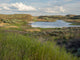 Columbia National Wildlife Refuge poster print featuring Migraine Lake by Jamie & Judy Wild.