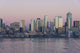 Twilight light on Seattle skyline and Elliott Bay poster print by Trish Drury.