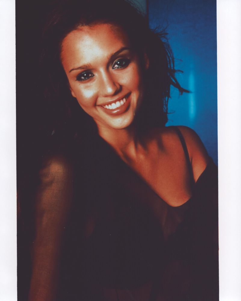 Jessica Alba smiling in a sheer top photo print
