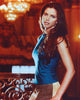 Charisma Carpenter in a blue tank top on a balcony, photo print.