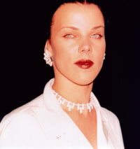 Close-up photo print of Debi Mazar wearing a white top.