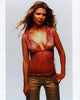 Tara Reid in a pink sheer top and gold pants photo print