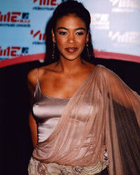 Ananda Lewis photo print in gold and sheer top, elegant and stylish.