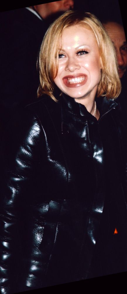 Oksana Baiul smiling in black leather photo print