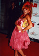 Betsy Johnson holding pink skirt on hip photo print